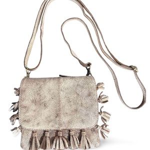Latico distressed crème crossbody with fringe tassels